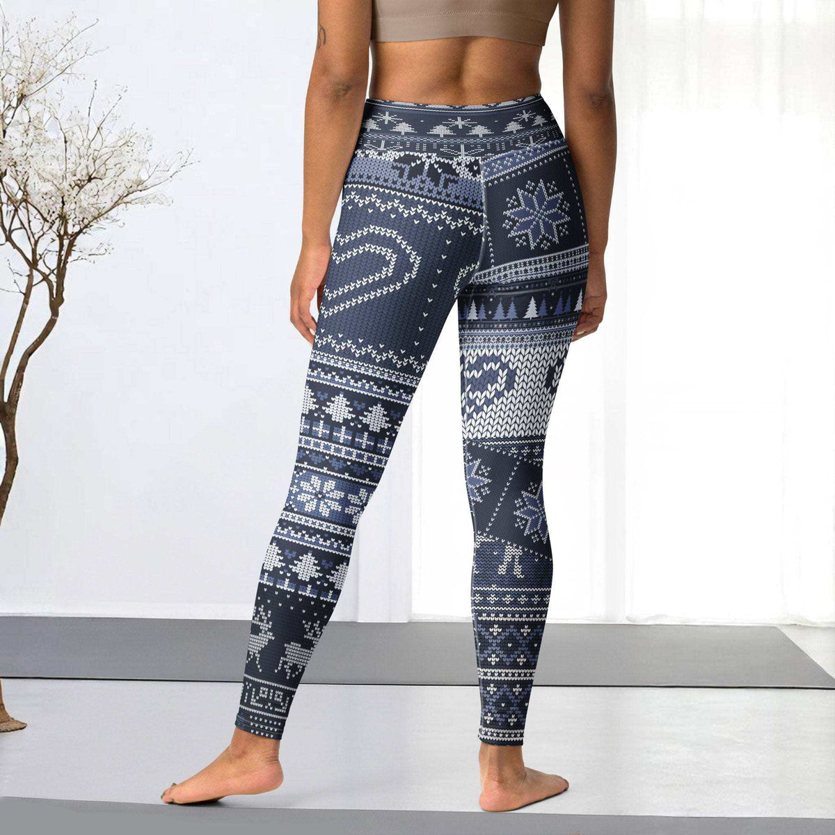 Blue festive holiday leggings with snowflakes and reindeer on navy