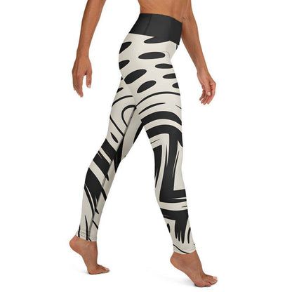 bold graphic leggings with black-and-cream abstract design and high-rise waistband