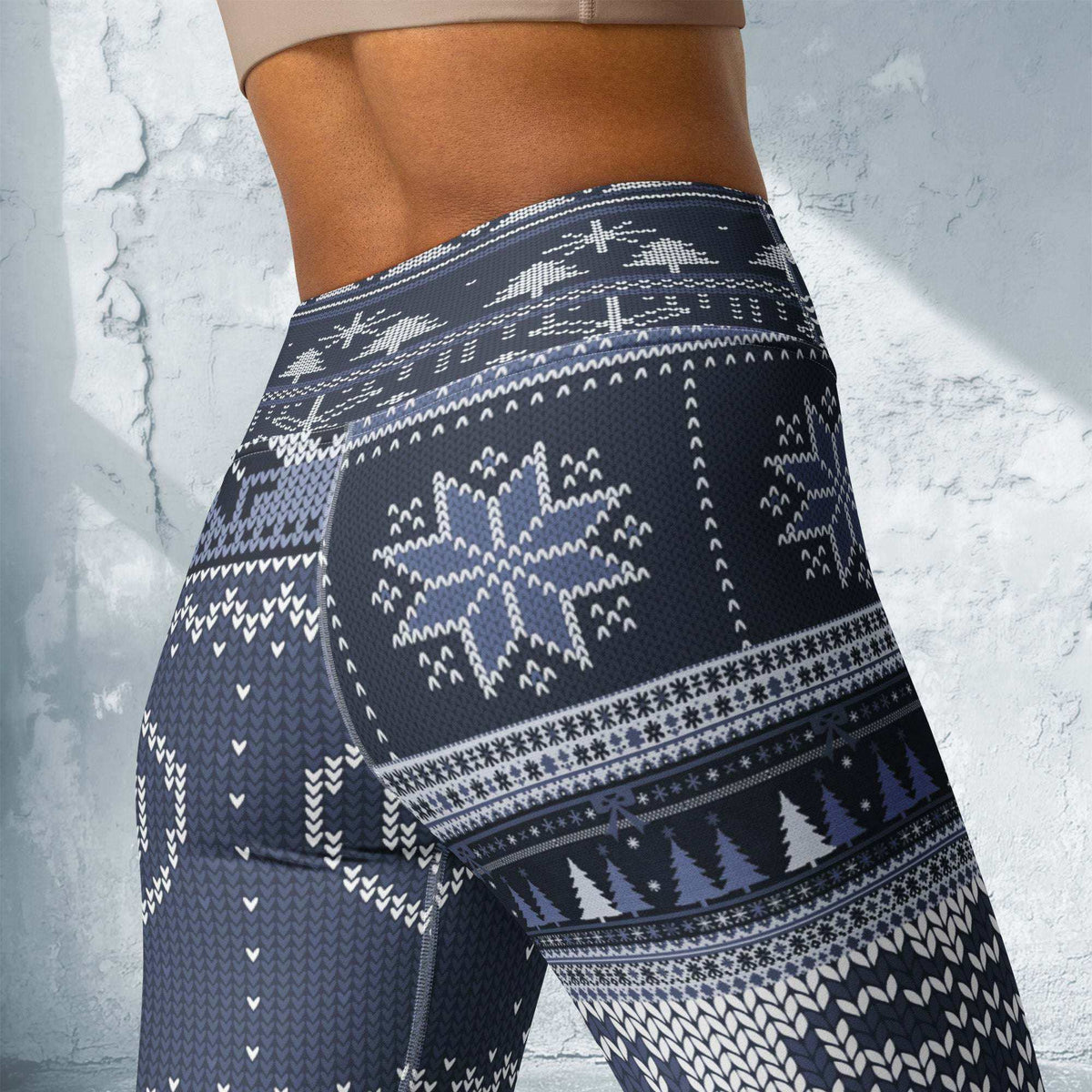 blue festive holiday leggings with snowflake and reindeer patterns
