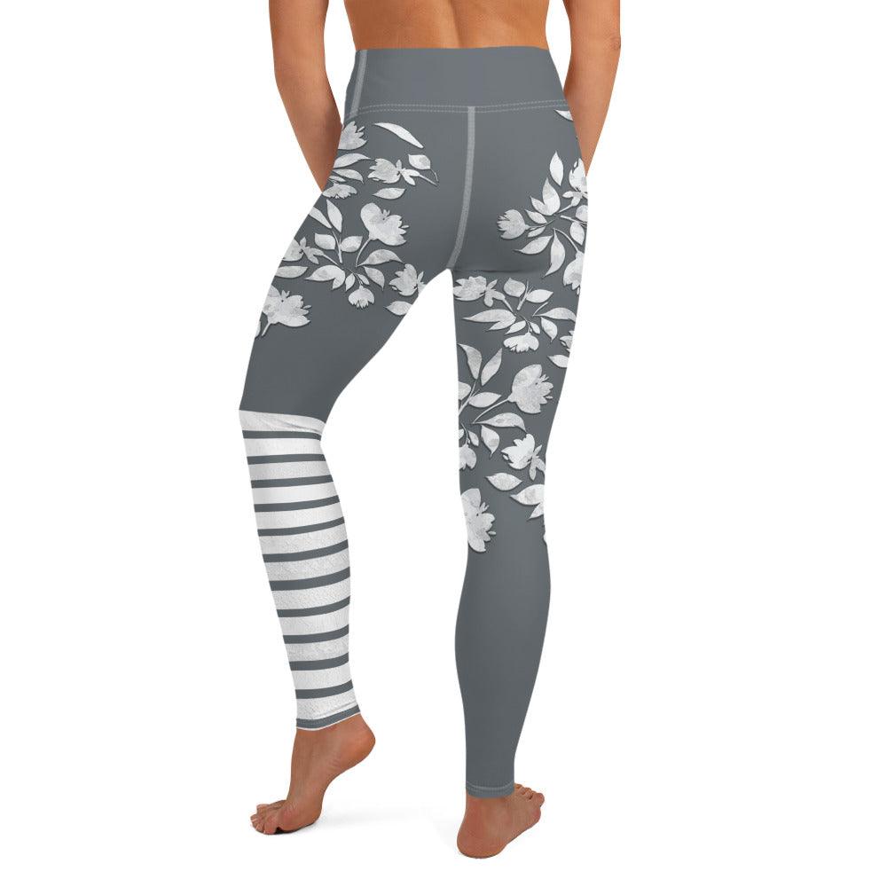 Charcoal-grey winter flower print leggings with white botanical blooms and sporty stripes