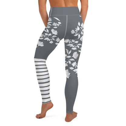 Charcoal-grey winter flower print leggings with white botanical blooms and sporty stripes
